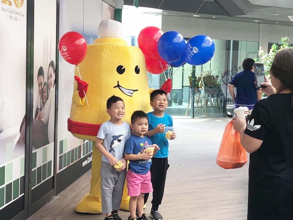 Events Marketing Walkway Flyer Distribution Mindstretcher mascot with children