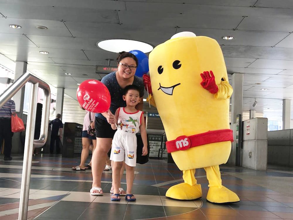 Events Marketing Walkway Flyer Distribution Mindstretcher mascot with child mother 2