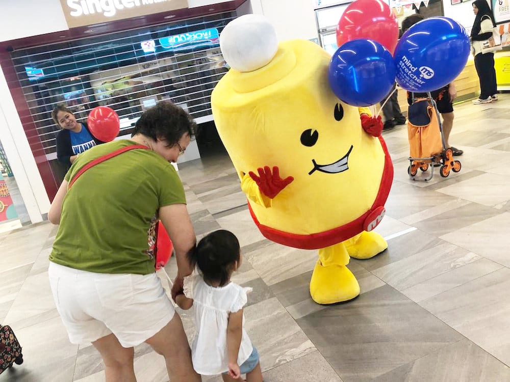 Events Marketing Walkway Flyer Distribution Mindstretcher mascot with child mother 3