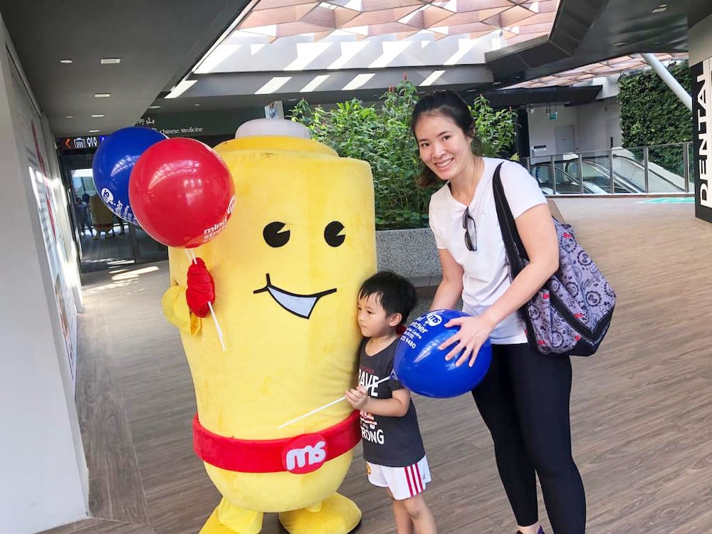 Events Marketing Walkway Flyer Distribution Mindstretcher mascot with child mother