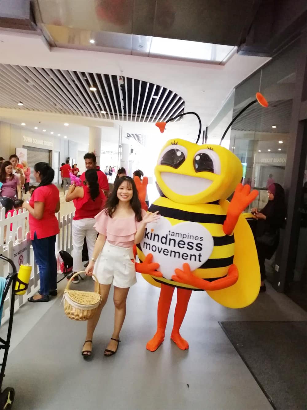 Walkway flyer distribution tampines hub bee mascot with distributor