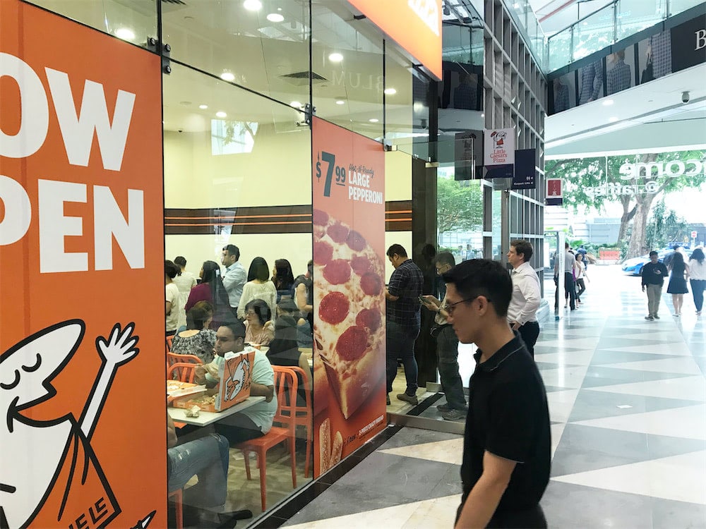 caesar walkway flyer distribution raffles place crowded restaurant