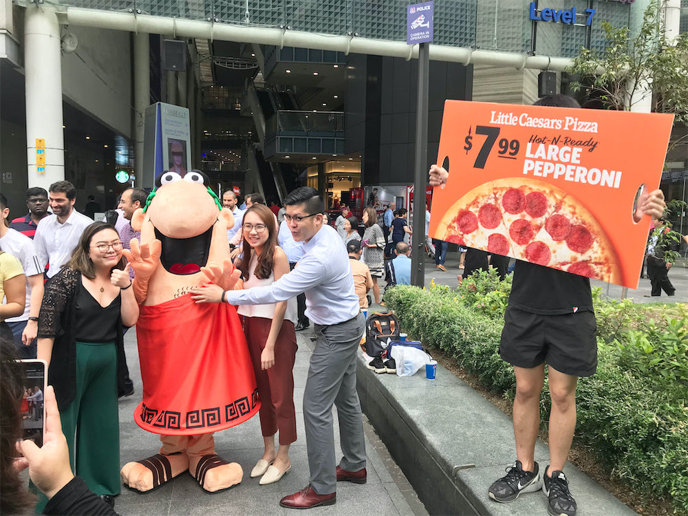 caesar walkway flyer distribution raffles place with mascot and people 10
