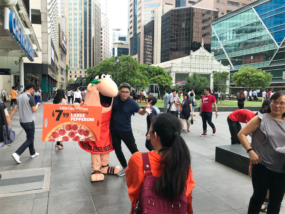 caesar walkway flyer distribution raffles place with mascot and people 11