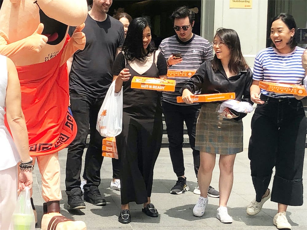 caesar walkway flyer distribution raffles place with mascot and people 2