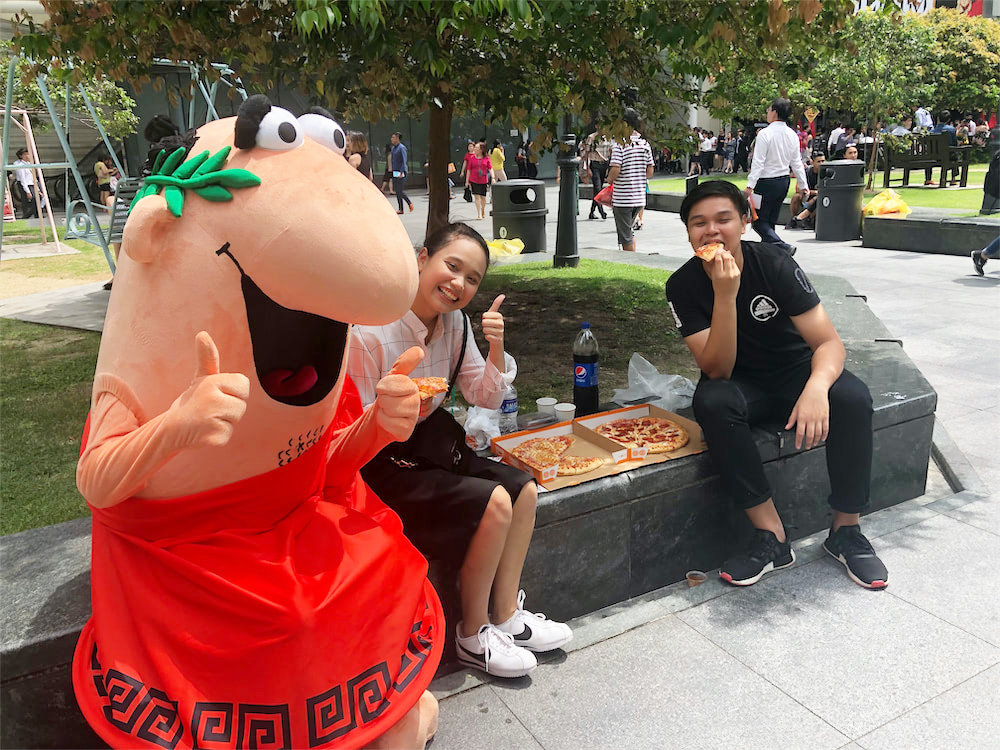 caesar walkway flyer distribution raffles place with mascot and people 5