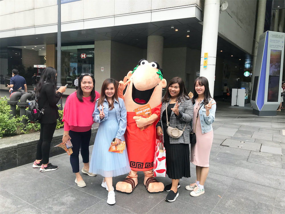 caesar walkway flyer distribution raffles place with mascot and people 6