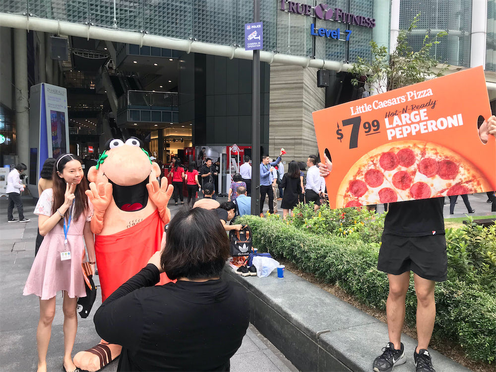 caesar walkway flyer distribution raffles place with mascot and people 9