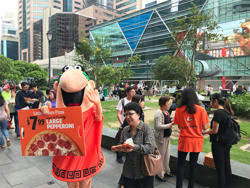 caesar walkway flyer distribution raffles place with mascot and people queuing for pizza 2