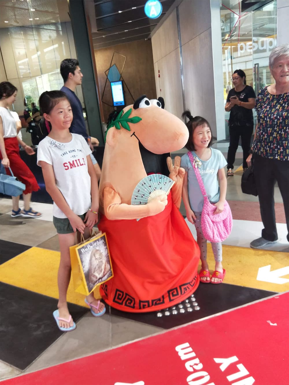 funan caesar pizza walkway mascot flyer distribution with children