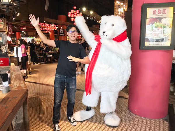 Coke bear at food republic events marketing posing for photo with customer 2
