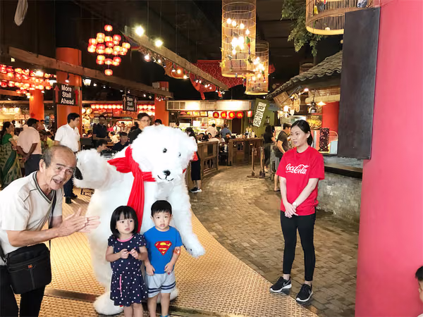 Coke bear at food republic events marketing posing for photo with customer 3