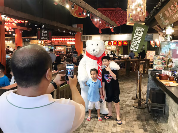 Coke bear at food republic events marketing posing for photo with customer 4