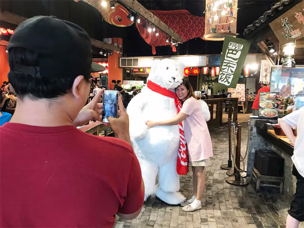 Coke bear at food republic events marketing posing for photo with customer 5