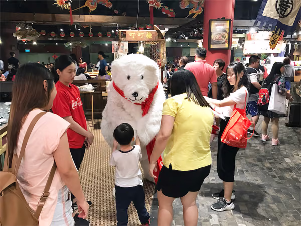 Coke bear at food republic events marketing posing for photo with customer 7