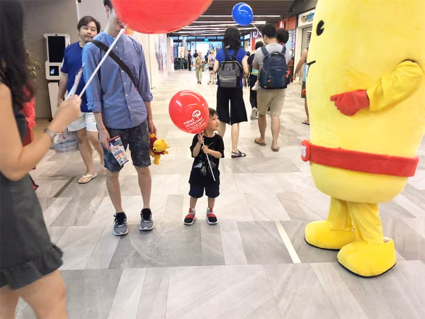 Events Marketing Walkway Flyer Distribution Mindstretcher mascot with child father