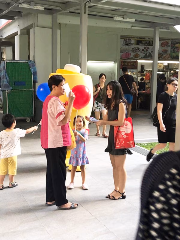 Events Marketing Walkway Flyer Distribution Mindstretcher mascot with child mother 4