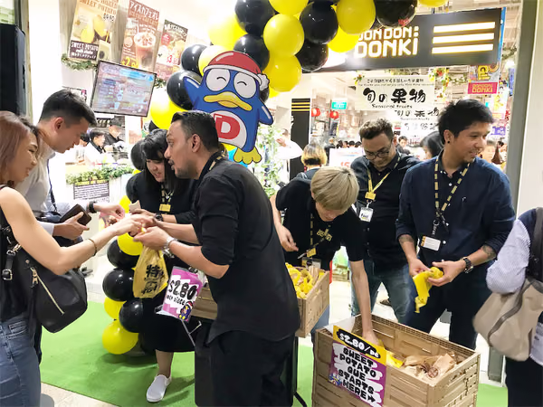 don don donki at novena event handing out sweet potatos 2