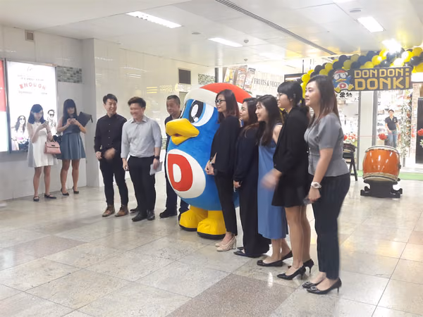 don don donki at novena event mascot with people posing for photo 2