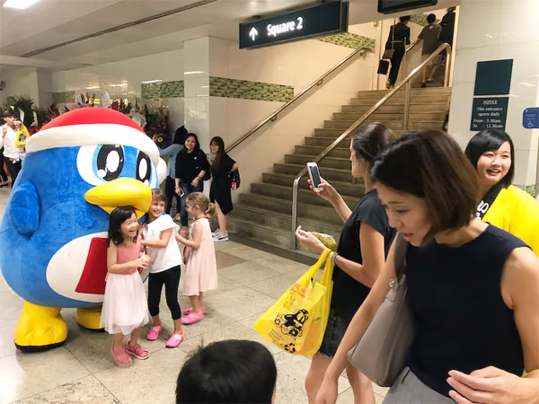 don don donki at novena event mascot with people posing for photo 3