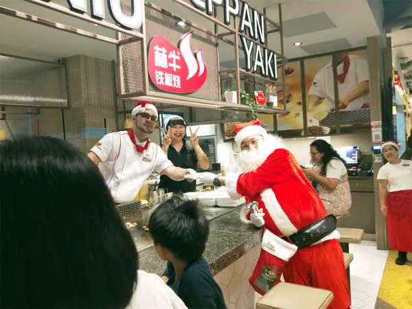 santa and assistant at food republic events marketing posing for photos with staff